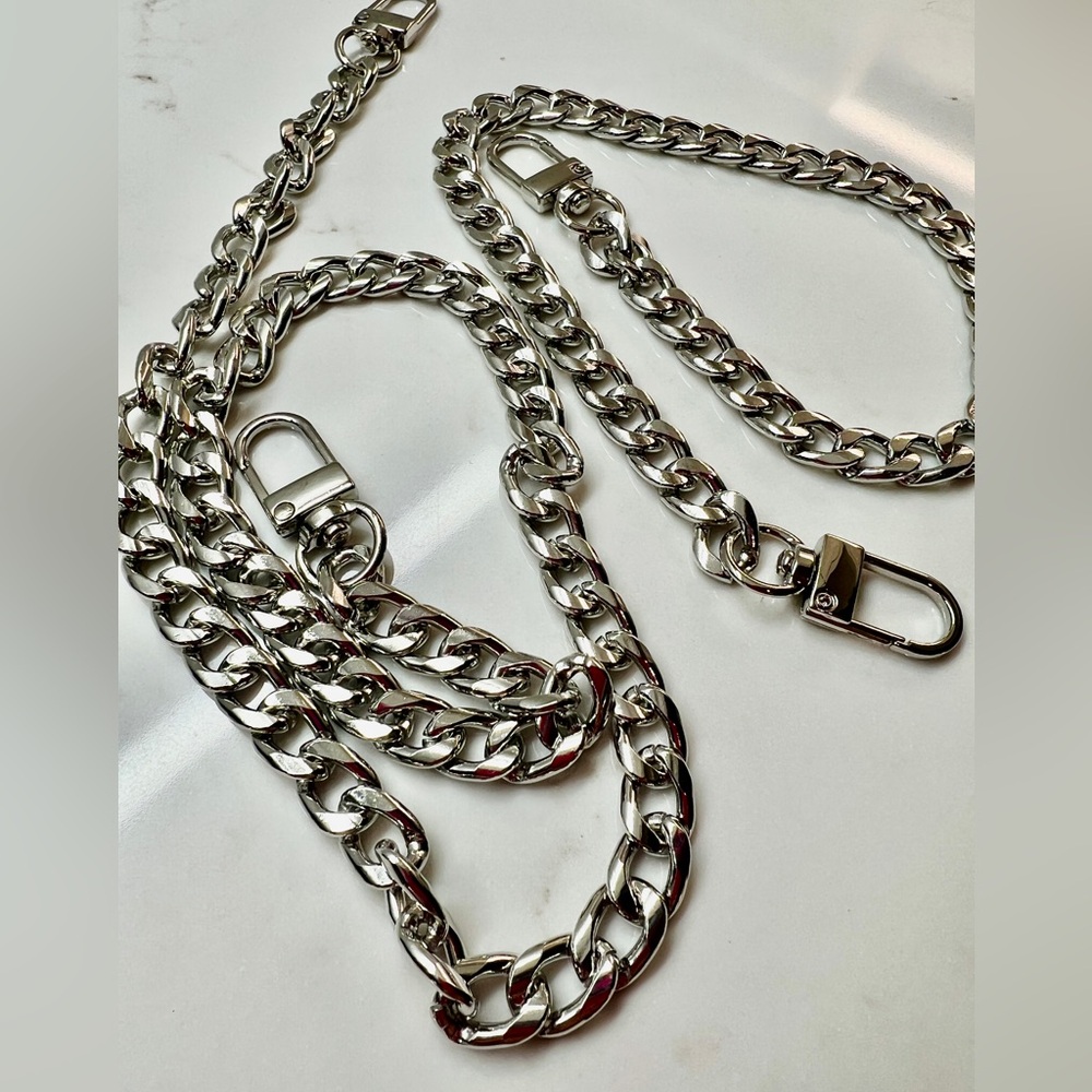 Unbranded silver chains for purses, or to make a wallet on chain.